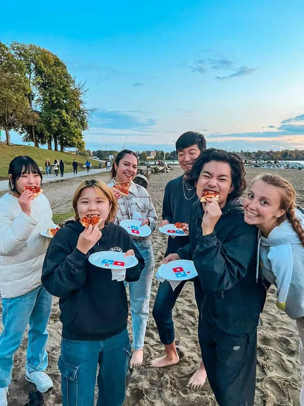 Students sharing food together outdoors