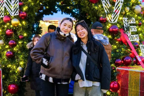 Student friends enjoying a Christmas market
